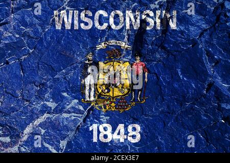 National American flag of Wisconsin on blue painted for Independence Day on a mountain wall. Rock graffiti of climbers during the ascent. Stock Photo