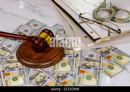Workplace legislation office judge's gavel symbol on file folder with law documents police handcuffs Stock Photo