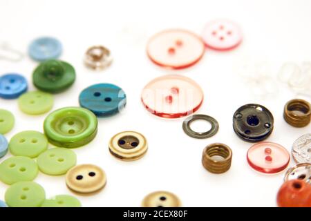 Flat lay with colorful sewing buttons, mock up, top view. Layout buttons mockup on blank white background for needlework, sewing, embroidery poster Stock Photo