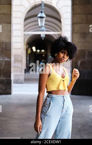 Serious black female wearing crop top 