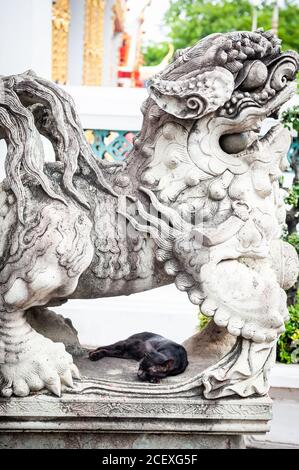 Ornate stone sculptures of animals and warriors at The Wat Pho Temple of The Reclining Buddha, Bangkok, Thailand.