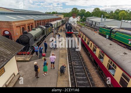 Steam train and rolling stock manoeuvres on the Bluebell Railway, heritage railway line at Sheffield Park station, East Sussex, England, UK Stock Photo