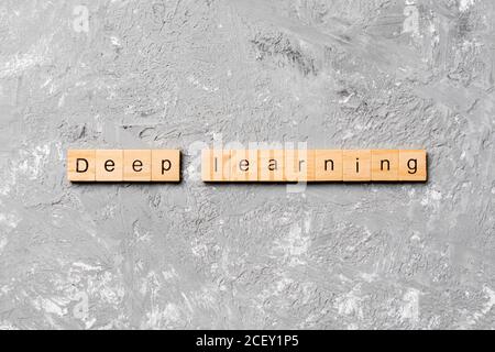Deep Learning word written on wood block. Deep Learning text on wooden table for your desing, concept. Stock Photo