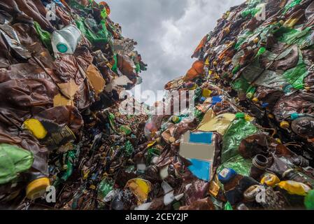 mountains of plastic bottles in a landfill for recycling. Waste recycling Stock Photo