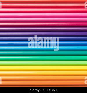 Close-up of a group of pencils arranged according to the light spectrum. Colorful background. Stock Photo