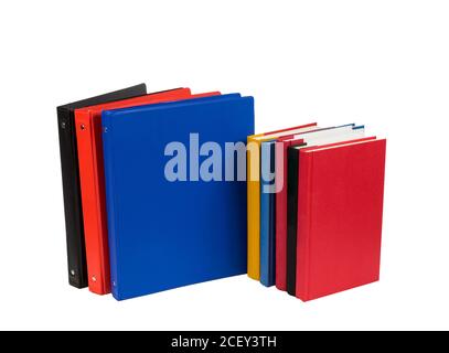 Horizontal shot of brightly colored notebooks and school books isolated on a white background. Stock Photo