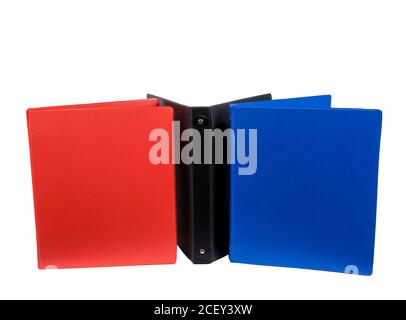 Brightly colored school notebooks standing showing lots of copy space isolated on white background. Stock Photo