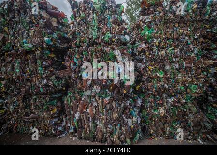 mountains of plastic bottles in a landfill for recycling. Waste recycling Stock Photo