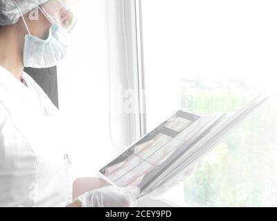 medical doctor watching a patient x-ray in hospital, tomography analysis Stock Photo