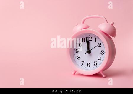 Pink alarm clock. Time is money mockup. Time-limit. Business deadline. Copy space Stock Photo