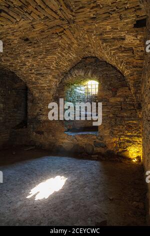 Rays of light shining into the medieval cellar Stock Photo