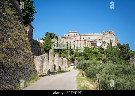 Beautiful Sermoneta village with old ruined columns, medieval houses and the famous Caetani Castle on the top of the hill. Traditional Italian landsca Stock Photo