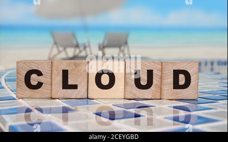 Cloud word on wooden cube on mosaic border. Big data cloud service concept Stock Photo