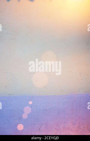 Abstract background and texture of painted wall with blue shadows. Colorful pink, yellow and blue shadows Stock Photo