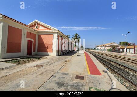 Torrellano, Alicante, Spain- July 28, 2020: Torrellano halt facility and old train station building under clear sky in summer. Stock Photo