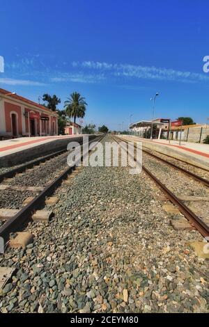 Torrellano, Alicante, Spain- July 28, 2020: Torrellano halt facility and old train station building under clear sky in summer. Stock Photo