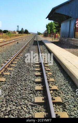 Torrellano, Alicante, Spain- July 28, 2020: Torrellano halt facility and old train station building under clear sky in summer. Stock Photo