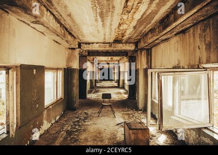 Creepy corridor. Mystical empty tunnel in abandoned house. Stock Photo