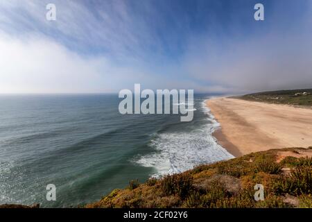 Nazare: Beautiful wide panoramic view of the beach facing the Atlantic Ocean near the Nazarè lighthouse in central Portugal near Obidos and Peniche. S