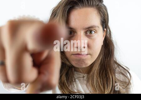 Angry woman pointing with index finger Stock Photo