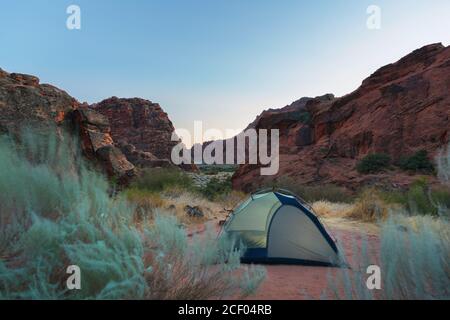 Sunset behind tent at campground, Snow Canyon State Park, Ivins, Utah, USA Stock Photo