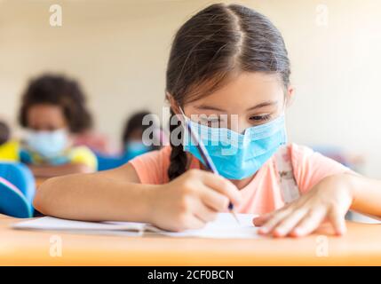 students wearing  mask and  studying in the classroom. Stock Photo