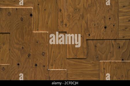 Textured surface of wooden boards cut and fit together in a rectangular geometric pattern Stock Photo