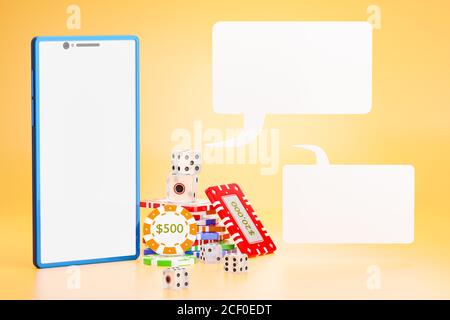 The dice and gambling chips are stacked next to the blue mobile phone and a blank white text box on an orange background. The concept of online casino Stock Photo