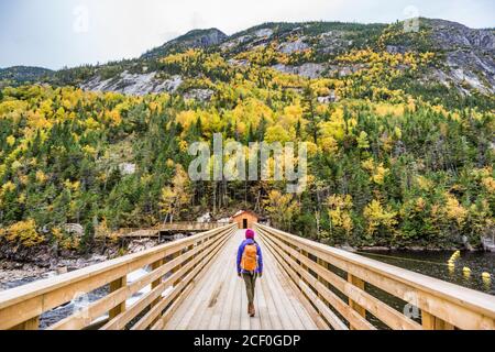 Hike woman walking in forest nature outdoor bridge Stock Photo