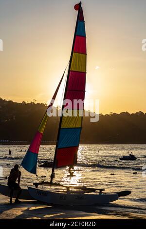 Sailing boat for hire on Patong Beach at sunset, Phuket, Thailand
