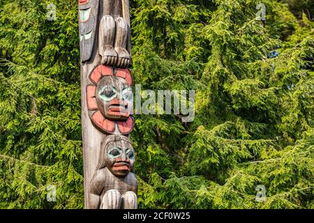 Alaska totem pole in Ketchikan, Alaska. Cruise travel destination vacation. Wood carving, traditional art. Stock Photo
