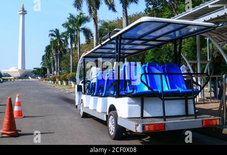 Jakarta, Indonesia - July 24, 2019: Electric car for transportation from parking area to Monument National (Monas). Stock Photo