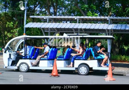 Jakarta, Indonesia - July 24, 2019: Electric car for transportation from parking area to Monument National (Monas). Stock Photo