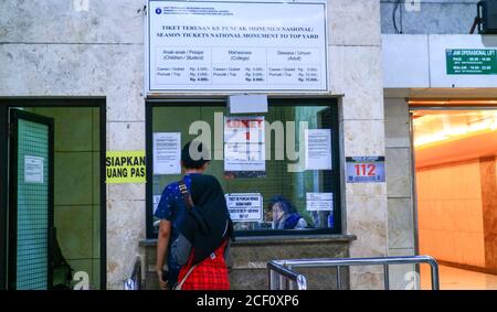 Jakarta, Indonesia - July 24, 2019: Visitors buy tickets to the top yard of the national monument (monas). Stock Photo