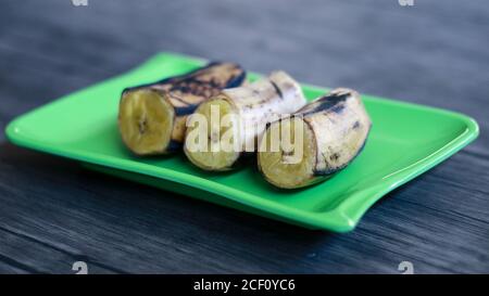 Boiled banana on wood background. Stock Photo