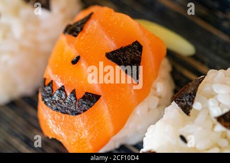 a holiday sushi roll dish with a Halloween theme for kids to enjoy at Halloween close up Stock Photo