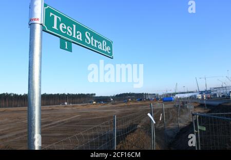 03 September 2020, Brandenburg, Grünheide: A road sign 'Tesla Straße 1' is located at the entrance to the Tesla Gigafactory construction site. The US electric car manufacturer wants to produce about 500,000 electric vehicles per year in Grünheide starting in summer 2021. Photo: Julian Stähle/dpa-Zentralbild/dpa Stock Photo