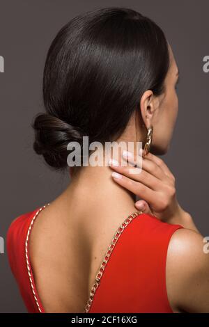 brunette with a haircut on her head. Smooth hair is gathered in a bump. hairstyle hair bun Stock Photo - Alamy brunette with a haircut on her head. Smooth hair is gathered in a bump. hairstyle hair bun Stock Photo - Alamy