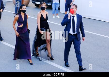 Palazzo del Cinema , Lido, Venice, Italy. 2 September 2020.  Attendees arrive wearing masks to the Opening Ceremony. . Picture by Julie Edwards./Alamy Live News Stock Photo