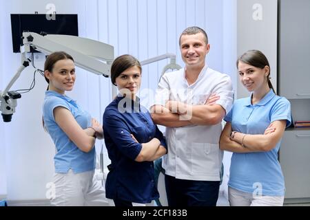 Team of colleagues dentists, portrait of doctors looking at the camera in dental office Stock Photo