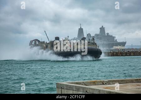 OKINAWA, Japan (Aug. 27, 2020) Landing Craft, Air Cushion 30, assigned to Naval Beach Unit 7, arrives at White Beach Naval Base. Germantown, part of the America Amphibious Readiness Group (ARG), 31st MEU team, is operating in the U.S. 7th Fleet area of operations to enhance interoperability with allies and partners and serve as a ready response force to defend peace and stability in the Indo-Pacific region. The America ARG, 31st MEU team remains the premier crisis response force in the region despite the unique challenges caused by the COVID-19 pandemic. (U.S. Marine Corps photo by Lance Cpl. Stock Photo