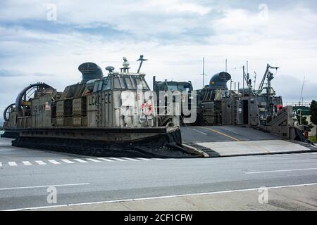 OKINAWA, Japan (Aug. 27, 2020) A landing craft, air cushion hovercraft assigned to Naval Beach Unit 7 prepares to depart White Beach Naval Base. Germantown, part of the America Amphibious Readiness Group (ARG), 31st MEU team, is operating in the U.S. 7th Fleet area of operations to enhance interoperability with allies and partners and serve as a ready response force to defend peace and stability in the Indo-Pacific region. The America ARG, 31st MEU team remains the premier crisis response force in the region despite the unique challenges caused by the COVID-19 pandemic. (U.S. Marine Corps phot Stock Photo