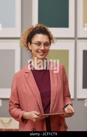 Portrait of female designer using digital tablet in her work she working at art gallery Stock Photo