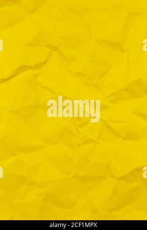 Textured crumpled green paper background. Vertical Stock Photo
