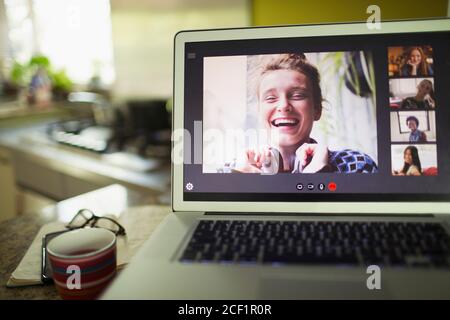 Happy women friends video conferencing on laptop screen Stock Photo