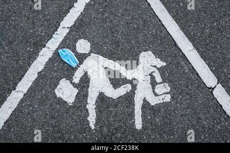 Face mask on road marking outside school. Schoolchildren, face mask, masks, Covid 19, Coronavirus...concept Stock Photo