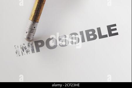 Changing the word impossible to possible with a pencil eraser. Motivation startup concept Stock Photo