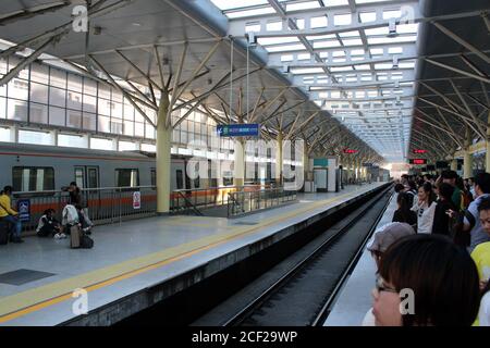 Beijing, China - 29 September 2012: Passengers waiting for subway train line 13 at Xizhi Men subway station. Stock Photo