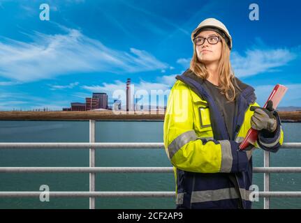 a female engineer on a ship in safety clothing Stock Photo