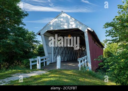 An old red and white covered bridge. Stock Photo